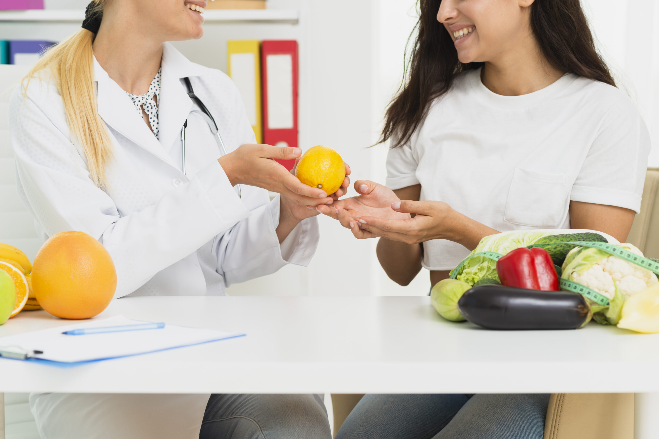 close-up-doctor-patient-discussing-about-lemons